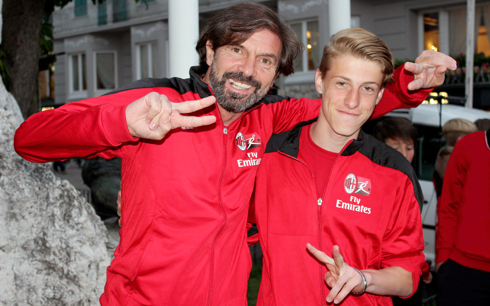 Filippo Galli, coach and former footballer, with a boy of the AC Milan Academy Camp