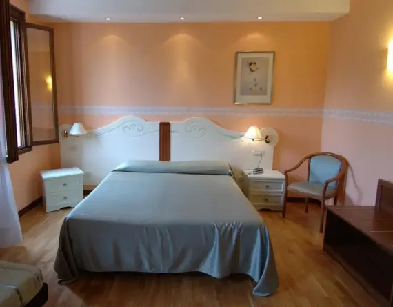 The bedroom of the Hotel Flora in Vittorio Veneto Italy