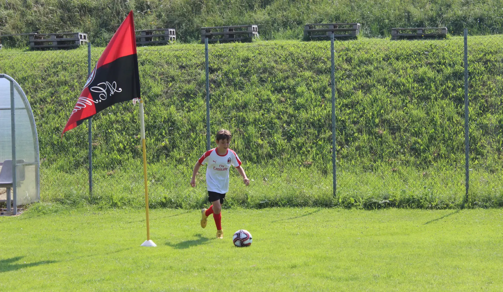 Child during the training in the AC Milan Soccer Academy Camp on Demand